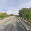 Power pole down blocks road at West Monitor Bridge
