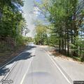 Report of speeding black convertible with lane issues