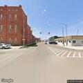 Officer contacts man on bicycle at intersection