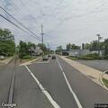 Car hits building near railroad tracks