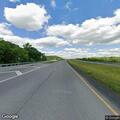 Disabled pickup truck with flat tire on US 72