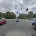 Car with missing tire on Cottage Grove Road