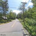 Single vehicle rollover into woods on Route 113