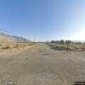 Vegetation fire behind home in Olancha