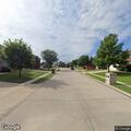 Car with flat tires driving on Kingswood Court