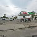Person drinking beer in parked vehicle