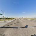 Elderly male walking in middle of road in Durant