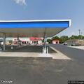 Handgun in holster found on ground near a gas pump