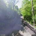 Black male laying in grass on Deer Run Dr