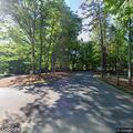 Person experiencing chest pain at Babbling Brook lobby