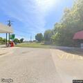 Vehicle accident on train tracks near business