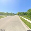 Deer in roadway needs to be put down on Slinger Road