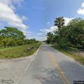 Construction fence and trees on fire in Loxahatchee