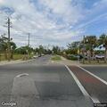 Officer checks unattended vehicle at intersection