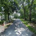 Elderly man suffers extreme back pain on Summer Road
