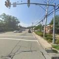 Small fire on top of telephone pole near gas station