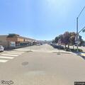 Water on roadway from power washing in Seaside