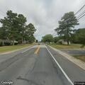 Low telephone line over road near Valero entrance