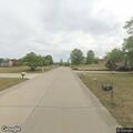 Person reported armed with a knife trying to enter a home