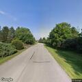 Man sliding out of wheelchair on roadside in Mequon