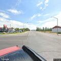 Pedestrian walking along Highway 6 and 50
