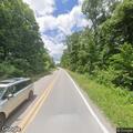 Traffic crash with fleeing black sedan