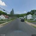 Driver slumped over after car hits curb