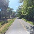Exposed manhole cover creates road hazard
