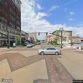 Officer checks white van on Lincoln Way East
