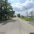 Person walking in middle of roadway on IL 161