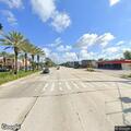 Man down wearing blue shirt on Orlando Avenue sidewalk