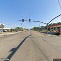 Person dancing in roadway at highway intersection