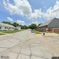 Suspicious people hiding between buildings in Neola