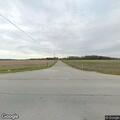 Vehicle drives through cornfield and leaves scene