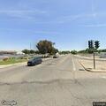 Vegetation fire along railroad tracks in Madera