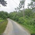 Tree caught in power lines with smoke reported