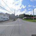 Two-vehicle crash blocking intersection, no injuries