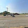Officer checks pickup truck near VFW in Stigler