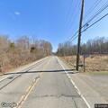 Large trash bag blocking roadway on State Route 208