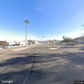 Person sitting in bike lane at Desert Vista and Saguaro