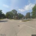 Male slumped over wheel in white car at Military and Beech