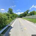 Officer with tractor trailer on Rogers Avenue
