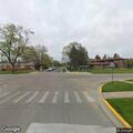 Female holding chest at intersection in Stickney