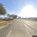 Pursuit vehicle hits road sign at Greens Road exit