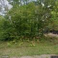 Grass fire near garage and propane tank in Birchwood
