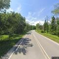 Vehicle knocks down roadside warning sign
