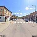 Car does burnout at parade intersection