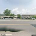 Person slumped behind building at Memorial Drive