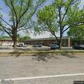 Person experiencing severe abdominal pain at apartment