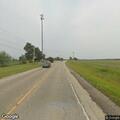 Officer checks unattended vehicle in field